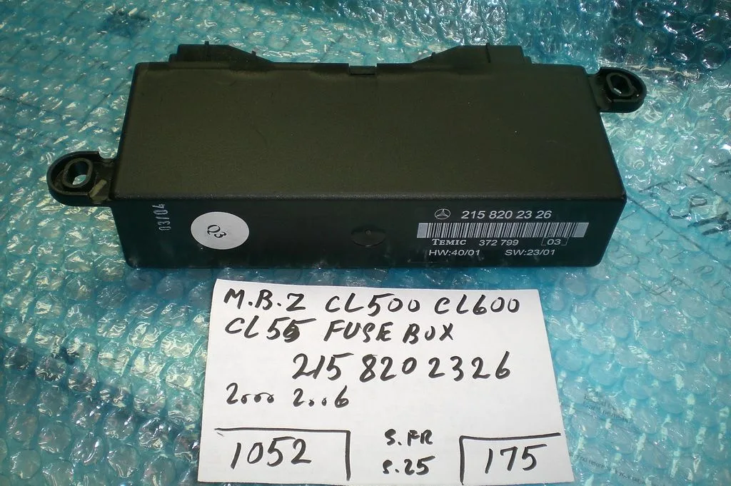 A Black Box Sitting On Top Of A Table Next To A White Piece Of Paper
