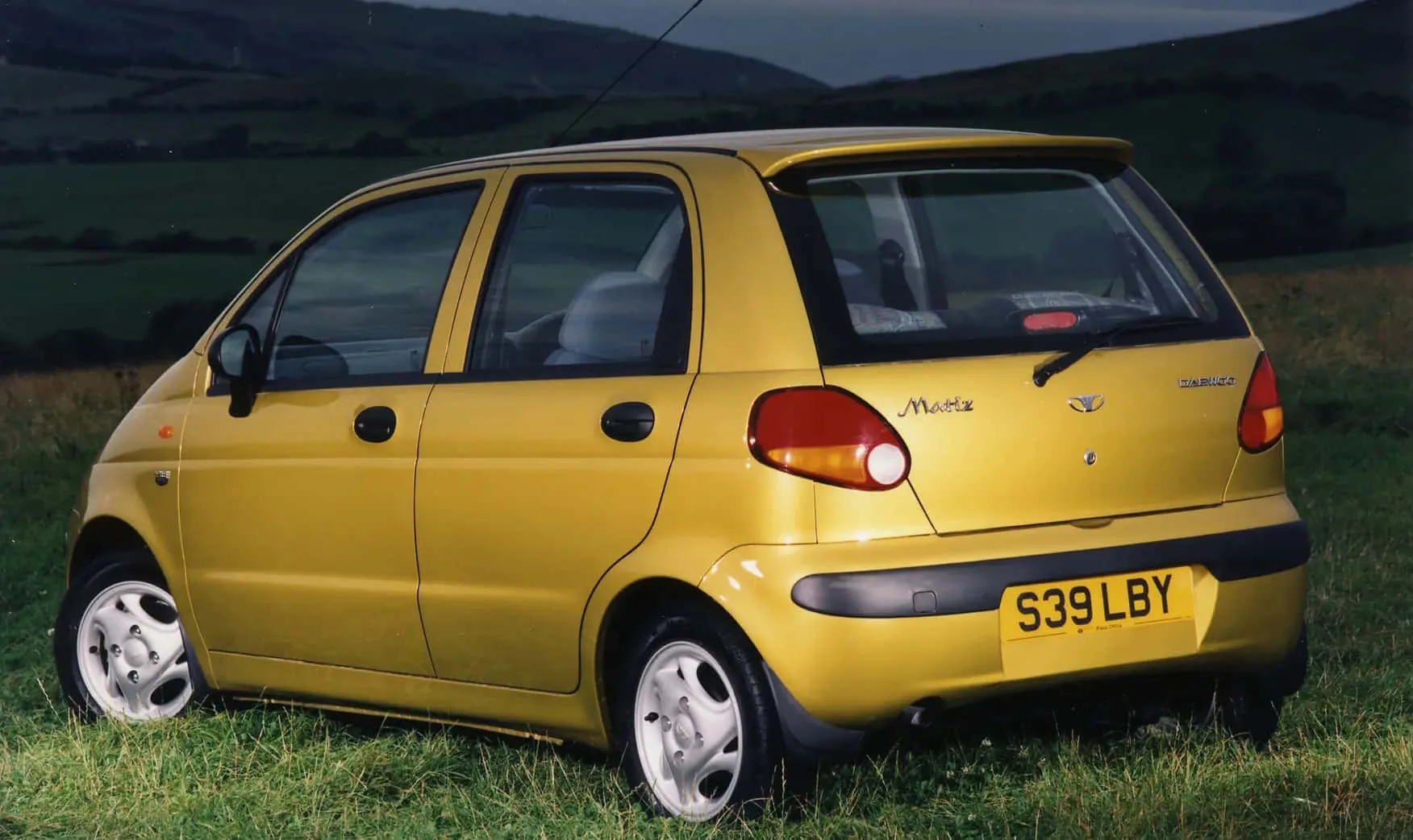 Download Daewoo Car On Road Wallpaper