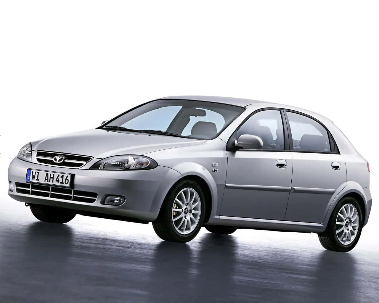 Download Daewoo Vehicle Parked In Nature Wallpaper