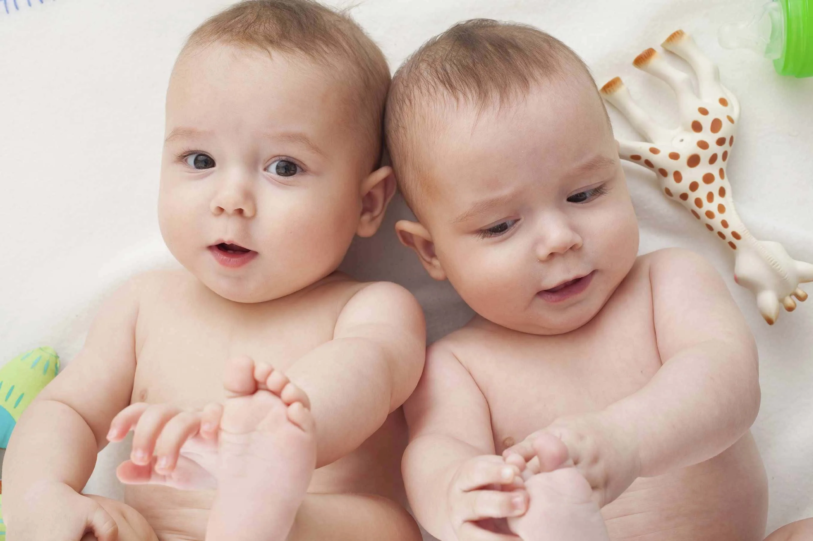 Download Happy Twin Babies Smiling Together