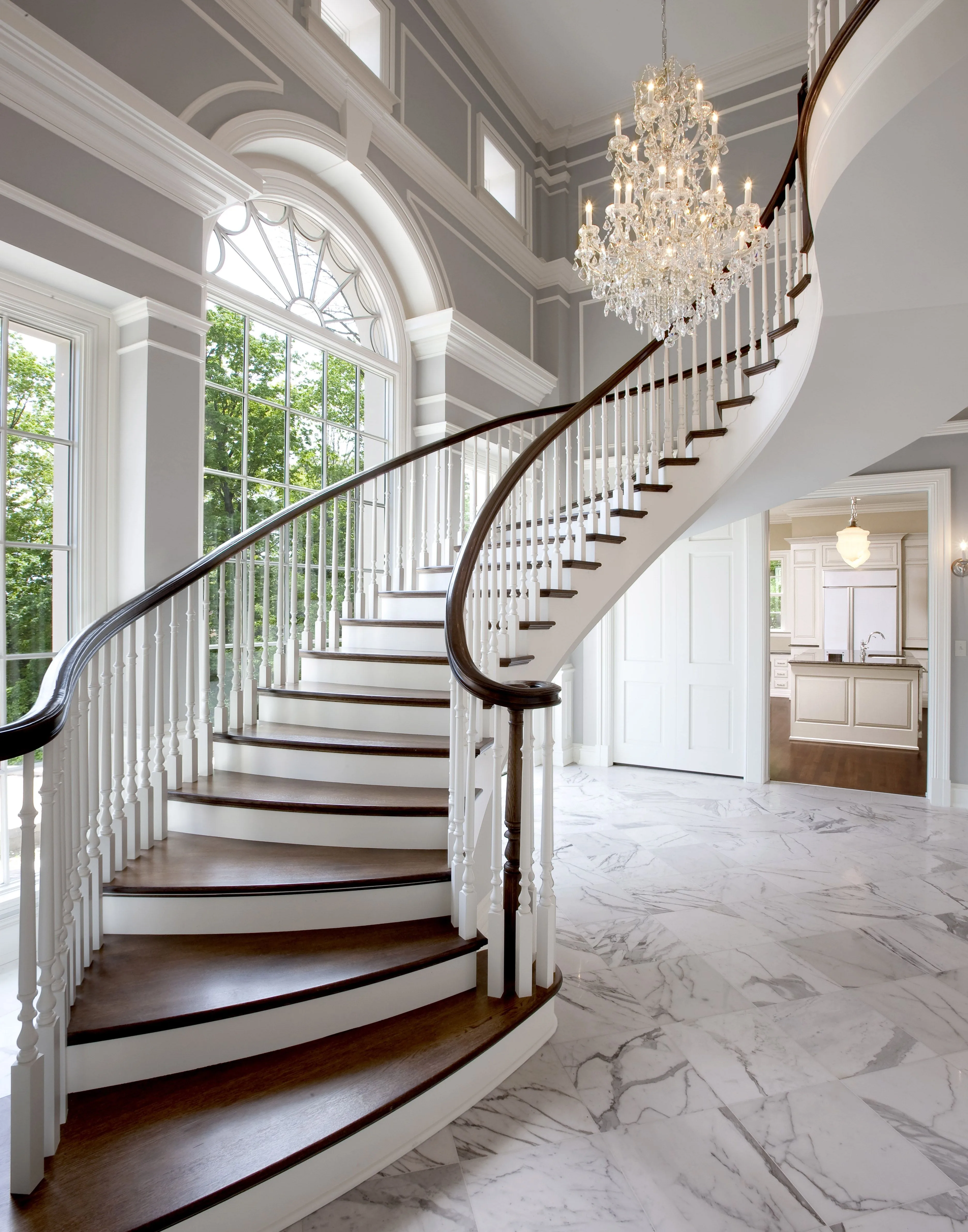 Grande Sweeping Entry Staircase In Grey Neutral Foye With White Moldings House Design