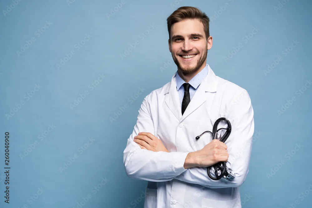 Portrait Of Confident Young Medical Doctor On Blue Background Foto De Stock Adobe Stock