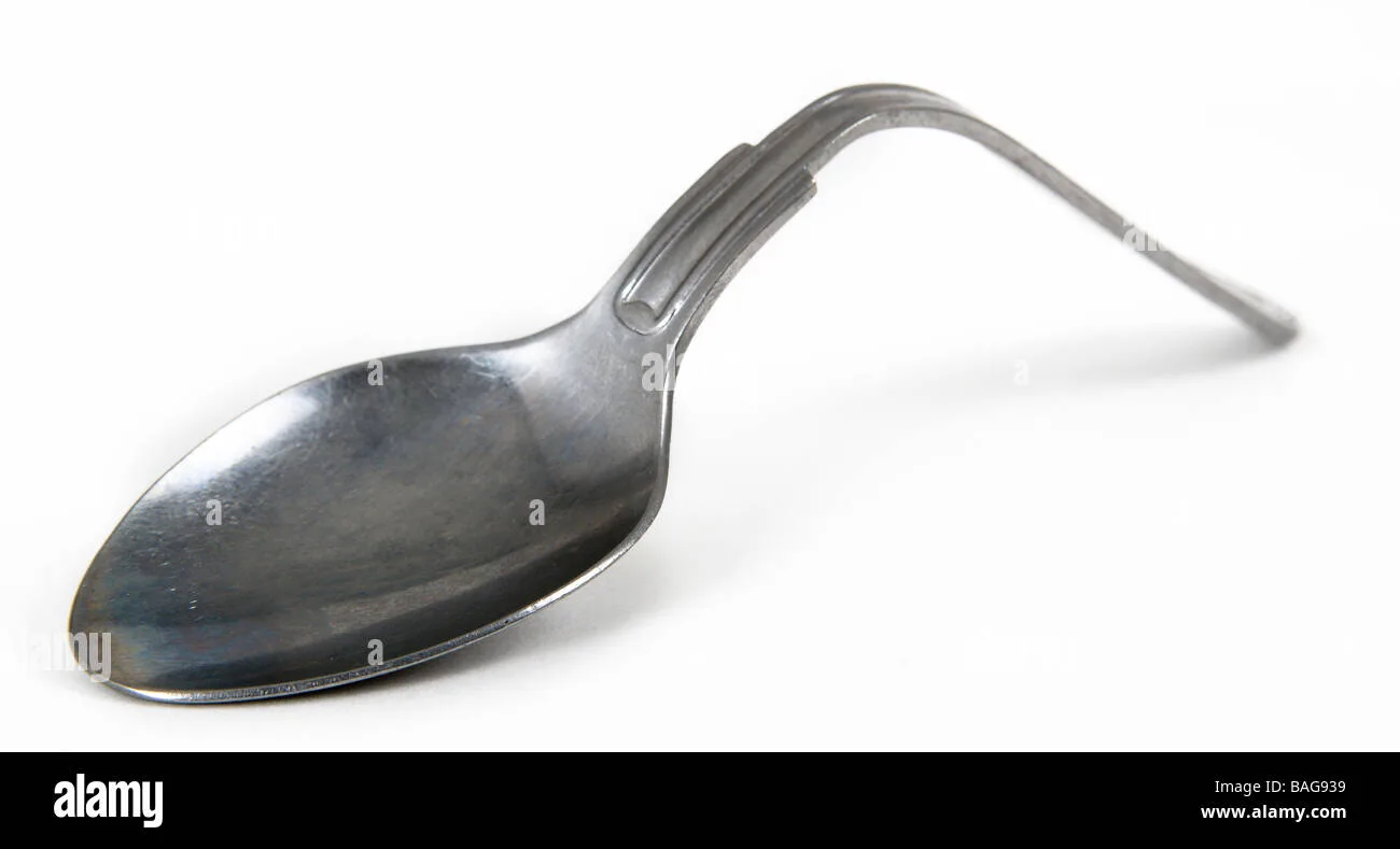 Spoon Bending Cut Out Stock Images Pictures Alamy