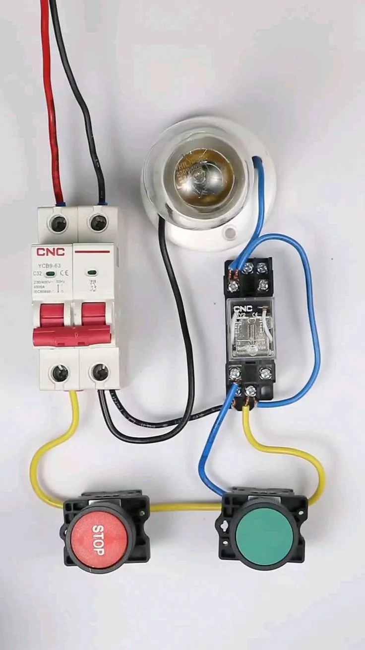 Three Different Types Of Switches And Wires On A White Surface With One Red Light In The Middle